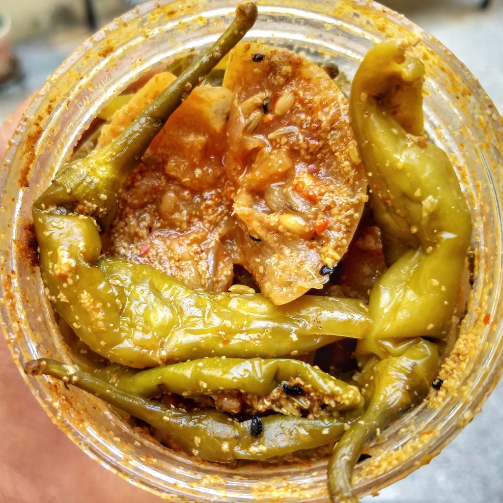 Green chillies and whole lemon pickle in classic pure vegetarian baniya style
